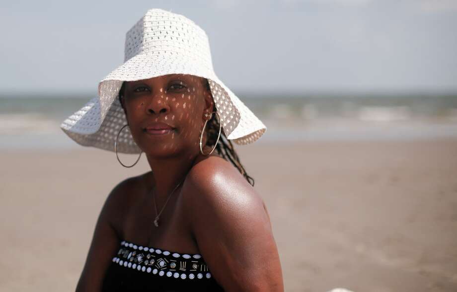 Shundra Cannon, of Pearland, finds the beach therapeutic. “It’s nice to get away from so much uncertainty, a getaway where you can still feel safe,” she says. Photo: Elizabeth Conley/Staff Photographer / © 2020 Houston Chronicle