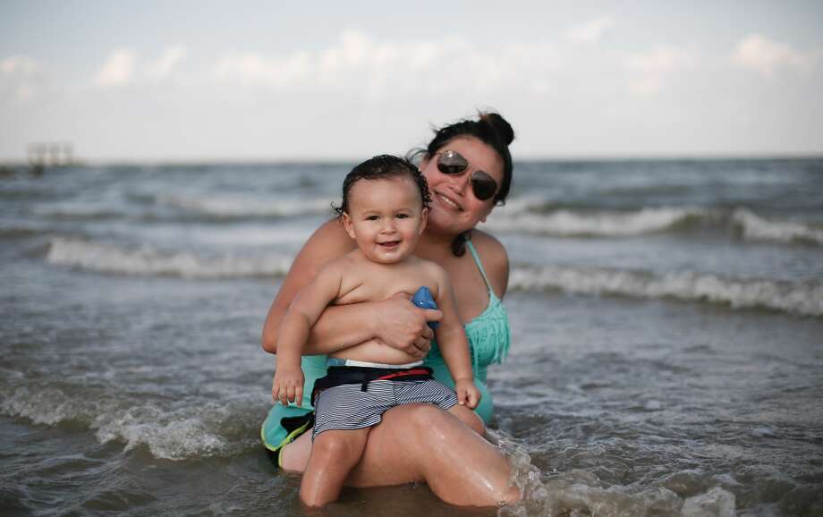 Dee Acosta and her son, Zachariah Guillot, 1 of Seabrook, Texas. "My husband grew up around here, we are thinking about buying a house here." Photo: Elizabeth Conley/Staff Photographer / © 2020 Houston Chronicle