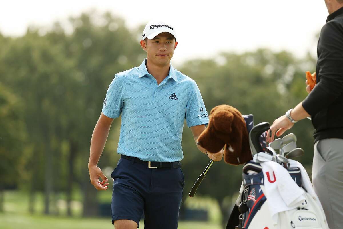 MAMARONECK, NEW YORK - SEPTEMBER 15: Collin Morikawa of the United States hands off his club to his caddie during a practice round prior to the 120th U.S. Open Championship on September 15, 2020 at Winged Foot Golf Club in Mamaroneck, New York. (Photo by Gregory Shamus/Getty Images)
