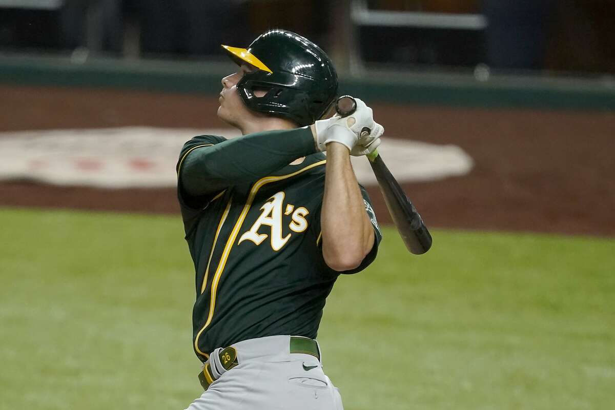 Oakland Athletics' Matt Chapman follows through on a fly out, leaving bases loaded, in the ninth inning of a baseball gam against the Texas Rangers in Arlington, Texas, Monday, Aug. 24, 2020. (AP Photo/Tony Gutierrez)