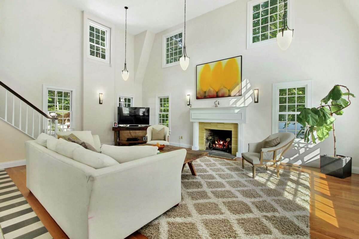 In the two-story family room there is a fireplace with a yellow brick surround. The main house was built in 1967 and underwent a dramatic rebuild in 2005. In addition to the main house the 1.83-acre level, sloping and treed property has a separate guest cottage with a kitchen, bedroom, and laundry; "perfect for in-laws or boomerangs," or an au pair suite, the co-listing agents said. "Fabulous entertaining spaces include the totally redesigned rear rock garden and huge slate patio with a custom, propane-fueled lava rock fire pit and picturesque perennials," the listing agents said.