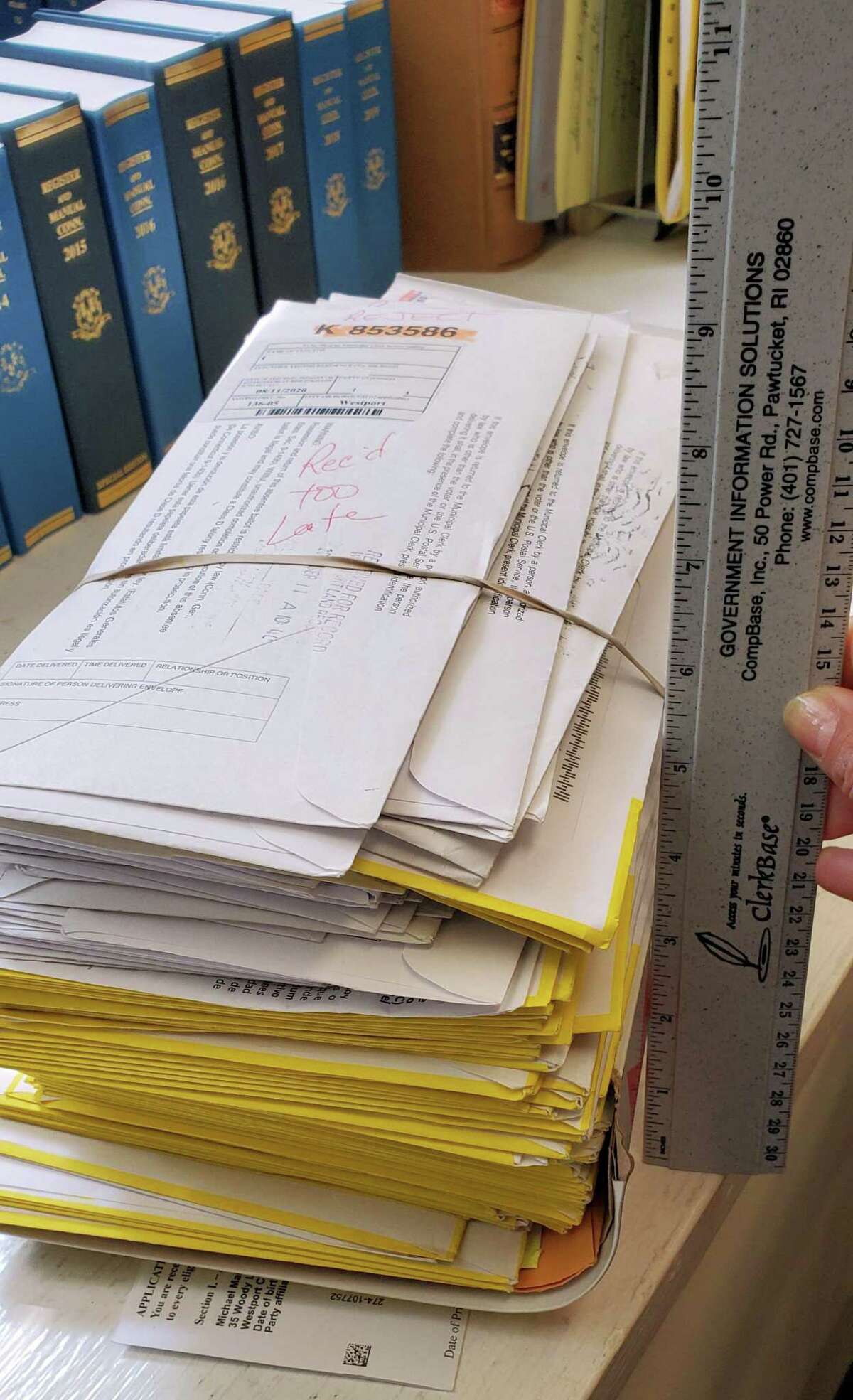 A stack of late ballots from the 2020 primary in Town Clerk Patricia Strauss' office.