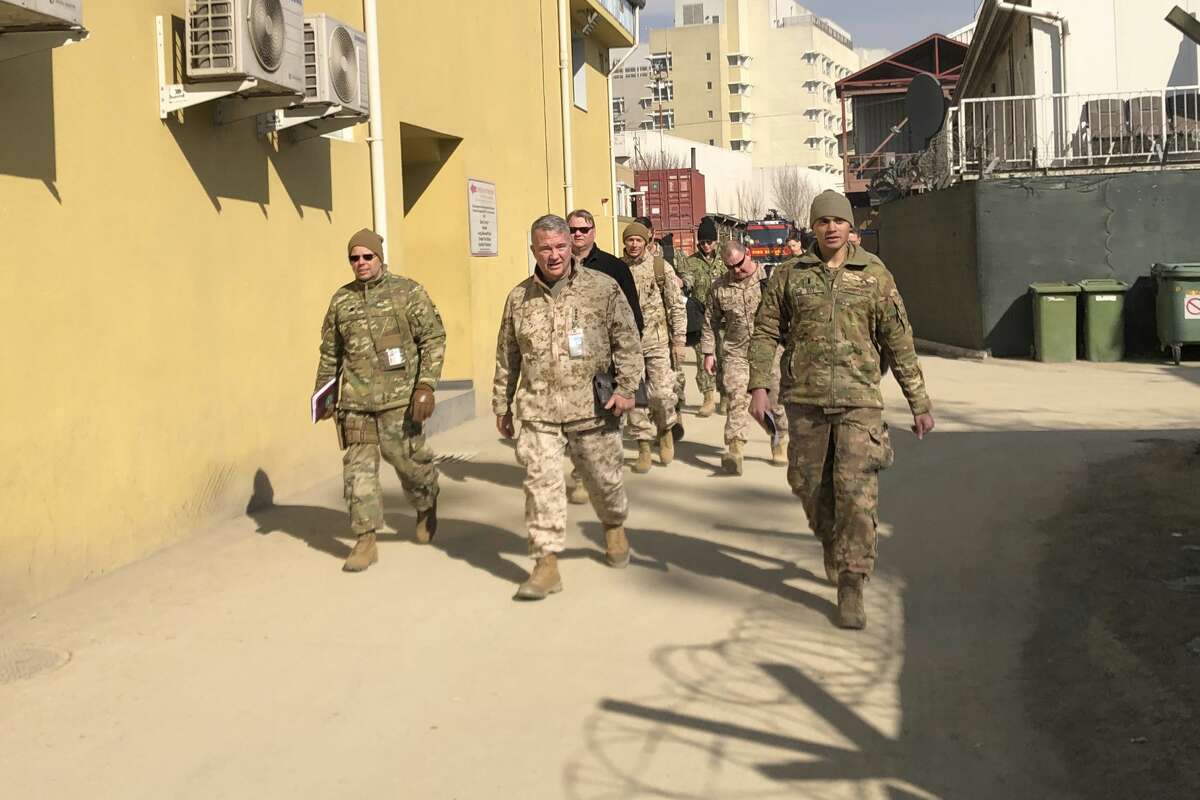 FILE - In this Jan. 31, 2020, file photo Marine Gen. Frank McKenzie, center, top U.S. commander for the Middle East, makes an unannounced visit in Kabul, Afghanistan. (AP Photos/Lolita Baldor, File)