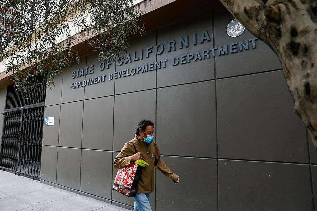A man walks by the Employment Development Department office on Monday, June 15, 2020 in San Francisco, California.