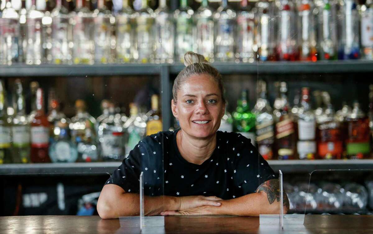 Julie Mabry, owner of Pearl Bar, poses for a photograph at the bar Tuesday, Sept. 15, 2020, in Houston. The Human Rights Campaign awarded Pearl Bar, Houston’s only lesbian bar, funding to help preserve it during the COVID-19 pandemic.