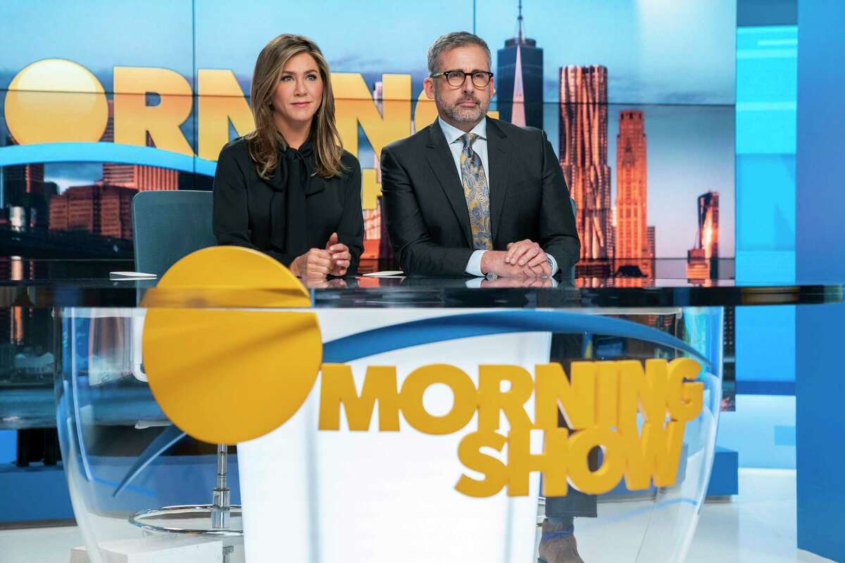 This image released by Apple TV Plus shows Jennifer Aniston, left, and Steve Carell in a scene from "The Morning Show." On Wednesday, Dec. 11, 2019, Carell was nominated for a SAG Award for best actor in a drama series. Aniston was also nominated for best actress in a drama series. (Hilary B. Gayle/Apple TV Plus via AP)