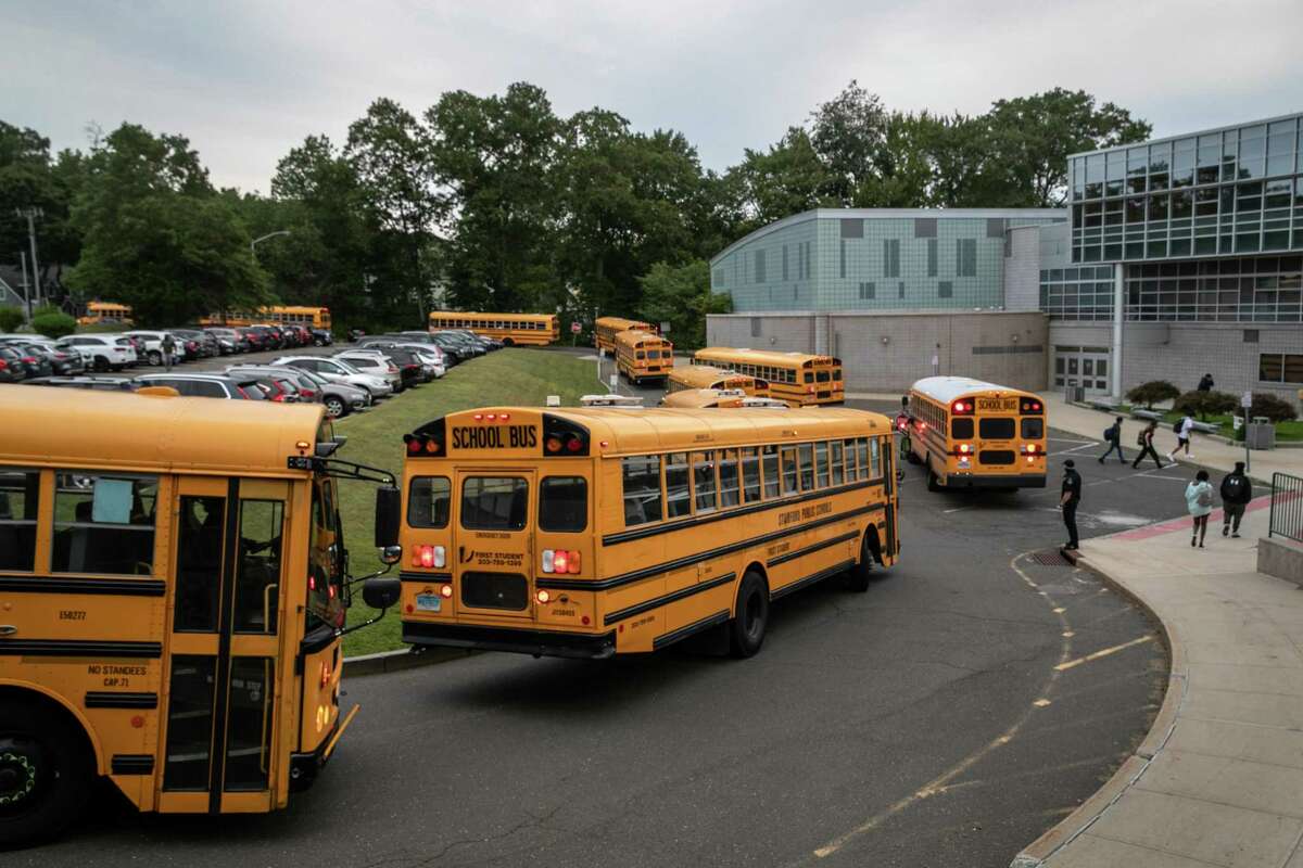 Buses drop-off students at Rippowam Middle School on September 14, 2020 in Stamford, Connecticut.