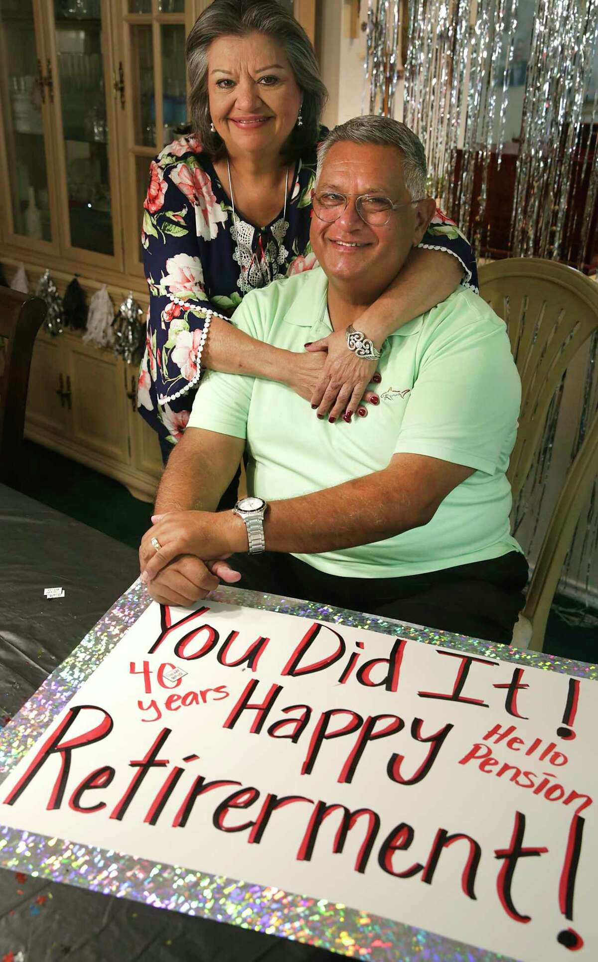 Roy Chapa, a VIA bus operator, etired after 41 years of driving the streets of San Antonio accumulating a whopping 3 million miles. He and his wife Elia are shown at home Wednesday. He was greeted at his last bus stop pick up with this sign made by his daughter.
