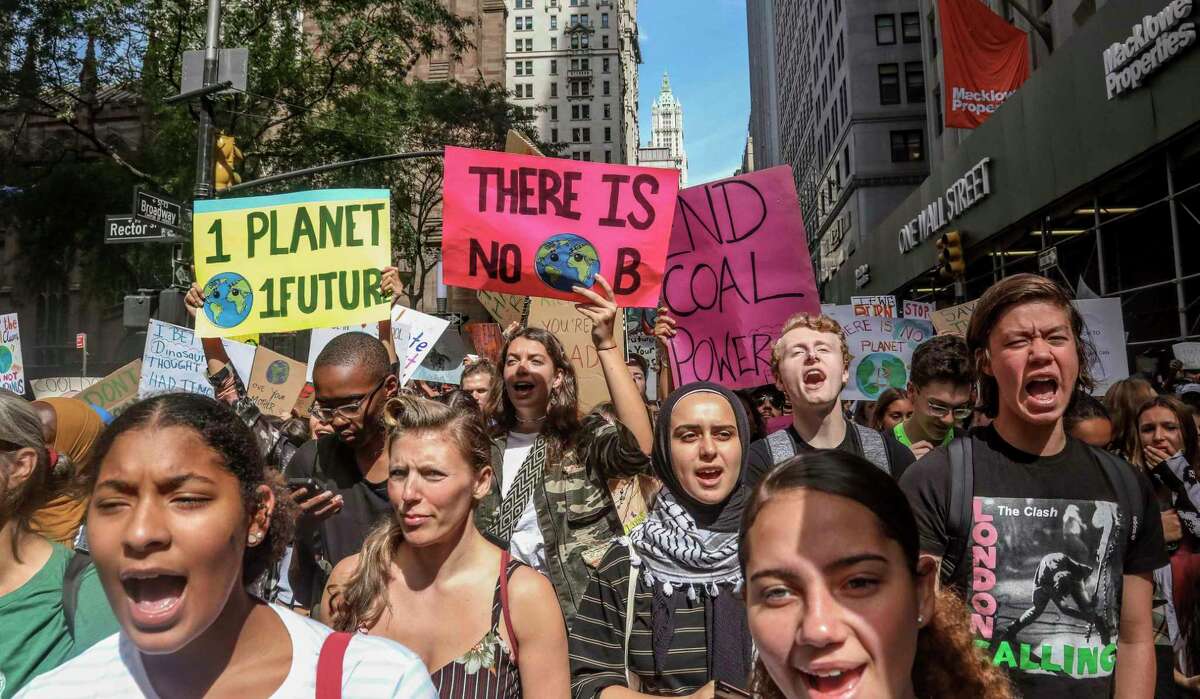 Climate change activists rally in New York as part of a global youth-led day of action in 2019. Is the rate of climate change to slow to cause alarm?