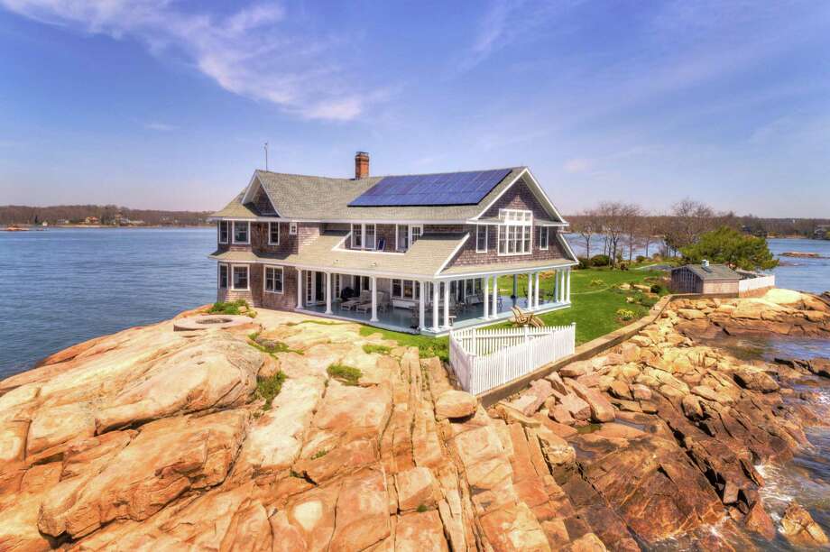 Potato Island, one of the Thimble Islands off the coast of Branford, CT, just sold for $4.2 million on Sept. 8, 2020, according to Page Taft-Christie's International Real Estate's Madison office. It was the highest value sale of 2020 in Branford and the second highest in New Haven County. The property includes a 3,781-square-foot house with four bedrooms, four bathrooms, a heated gunite pool, a custom granite Jacuzzi, boat facilities and a deep water dock, a wrap-around porch and 360-degree water views. Photo: Randal Alquist Photography / Contributed