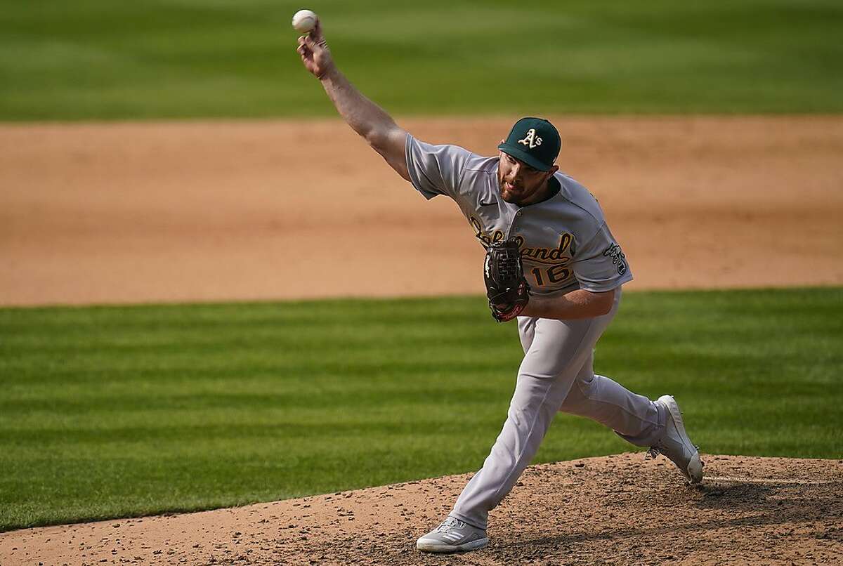 Oakland Athletics relief pitcher Liam Hendriks (16) throws against the Colorado Rockies during the eighth inning of a baseball game, Wednesday, Sept. 16, 2020, in Denver. (AP Photo/Jack Dempsey)