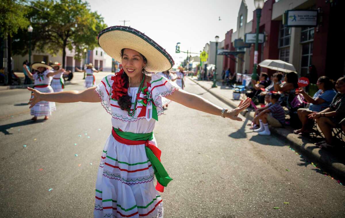 Patricia Ortiz and members from Kazamba Dance & Drum group dance during the 39th annual West Side Diez y Seiz parade celebrates Mexico?•s Independence Day as well as the city?•s strong ties to Mexican culture on Saturday, Sept. 14, 2019. It?•s part of a daylong celebration across the city that will be capped off with a night time river parade headed by El Rey Feo.