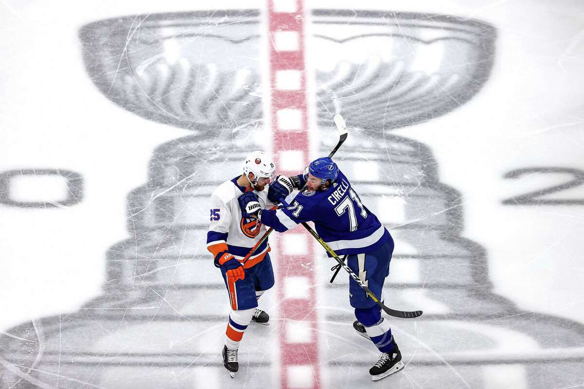 EDMONTON, ALBERTA - SEPTEMBER 15: Anthony Cirelli #71 of the Tampa Bay Lightning checks Devon Toews #25 of the New York Islanders during the third period in Game Five of the Eastern Conference Final during the 2020 NHL Stanley Cup Playoffs at Rogers Place on September 15, 2020 in Edmonton, Alberta, Canada. (Photo by Bruce Bennett/Getty Images)