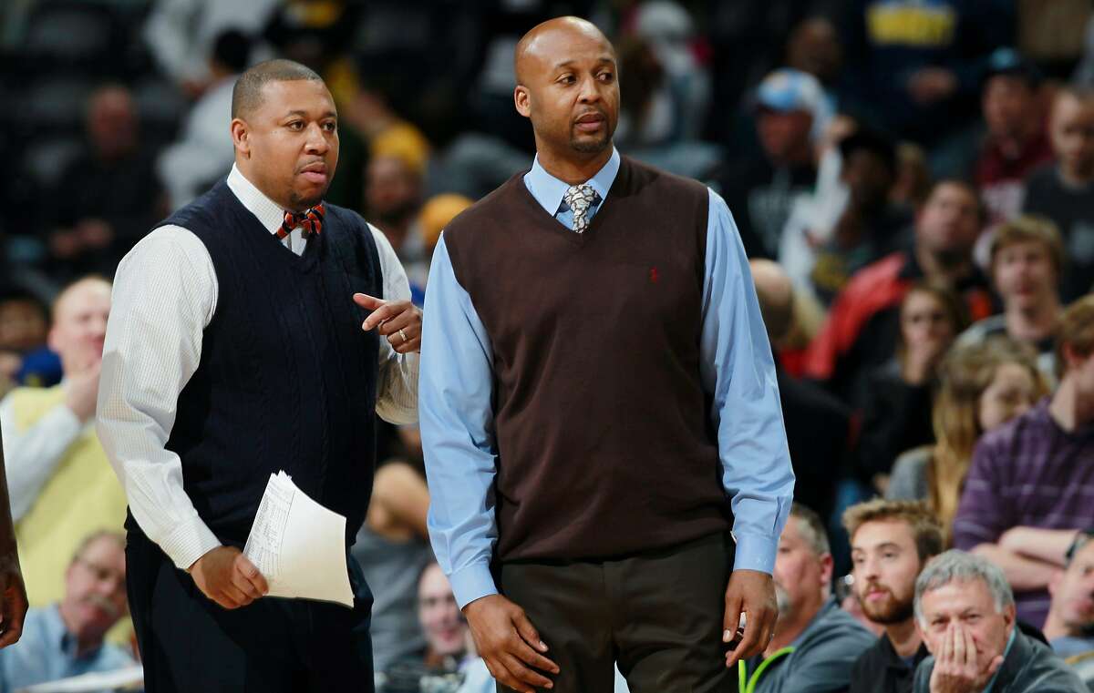 FILE - In this April 16, 2014, file photo, Denver Nuggets assistant coach Melvin Hunt, left, joins head coach Brian Shaw in contesting a call while facing the Golden State Warriors in the fourth quarter of the Warriors' 116-112 victory in an NBA basketball game in Denver. The Nuggets have fired coach Brian Shaw after 1� seasons. General manager Tim Connelly said in a statement Tuesday, March 3, 2015: "You won't find a better guy than Brian and he is one of the brightest basketball minds I've ever been around. Unfortunately things didn't go as we hoped, but we know with his basketball acumen that he has a very bright future ahead of him." Assistant coach Melvin Hunt will serve as interim coach. (AP Photo/David Zalubowski, File)