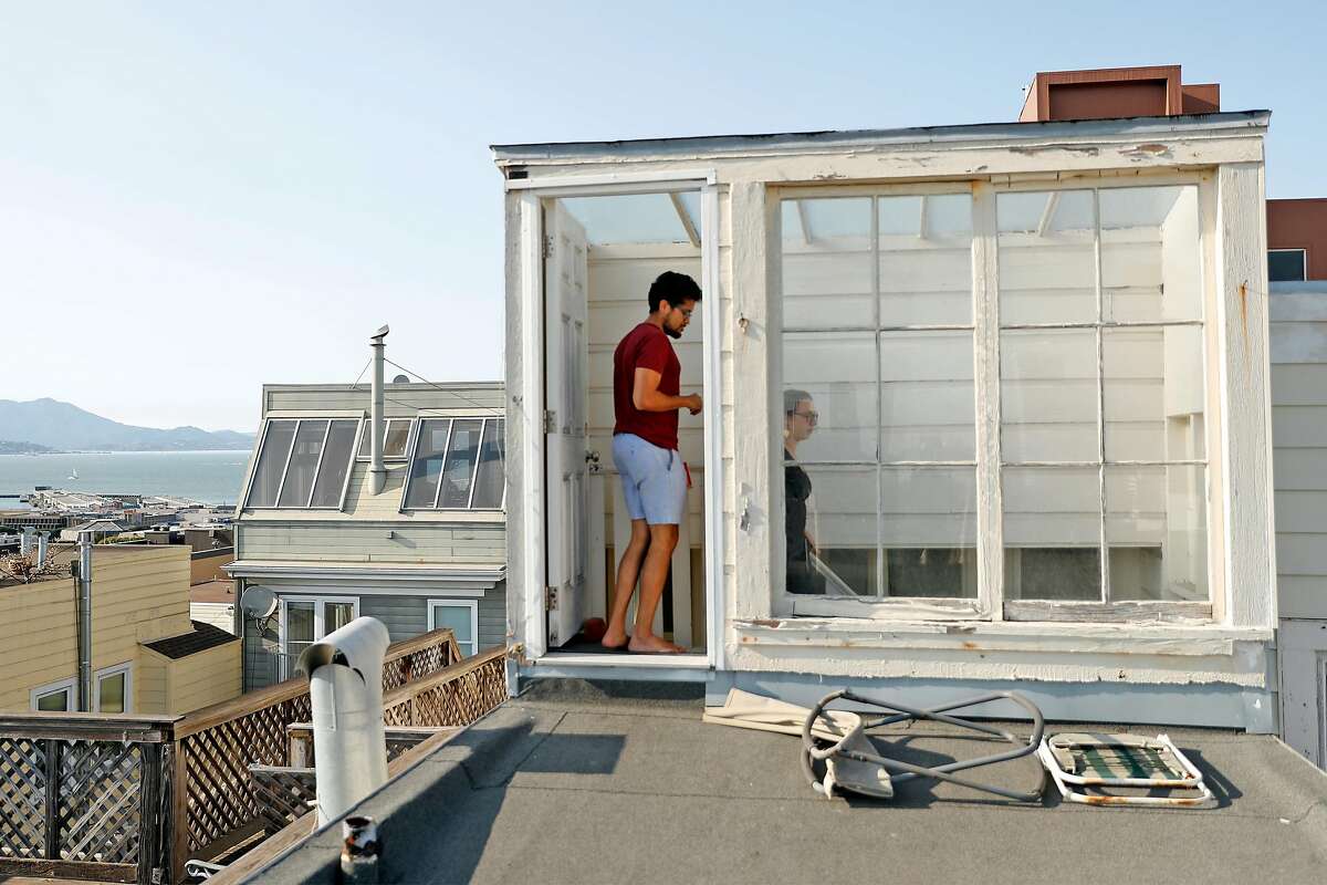 Santosh Vadlamani and Ally Sillins on the roof of their home in San Francisco, Calif., on Wednesday, September 16, 2020. The couple have bucked the trend by purchasing a home in San Francisco.
