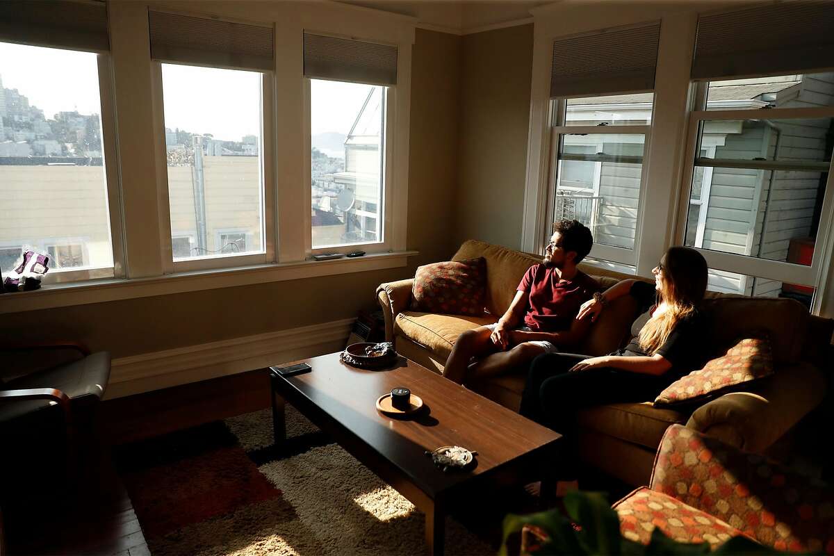 Santosh Vadlamani and Ally Sillins in the living room of their home in San Francisco, Calif., on Wednesday, September 16, 2020. The couple have bucked the trend by purchasing a home in San Francisco.