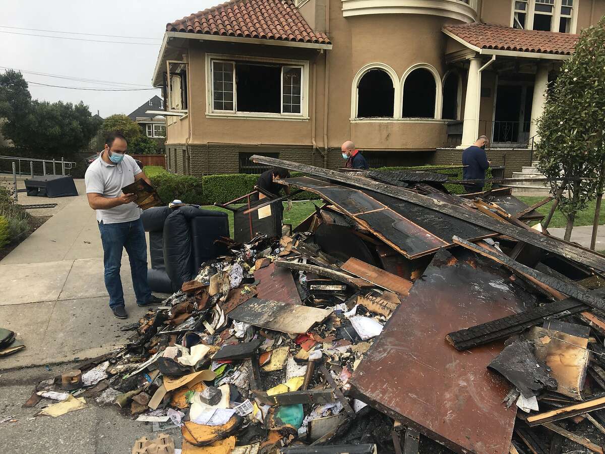 Parishoners at St. Gregory Armenian Apostolic Church clear out charred remains of their church, which burned overnight or early Thursday. Church members are deeply troubled, since the fire follows the tagging of an Armenian school with hateful graffiti in July.