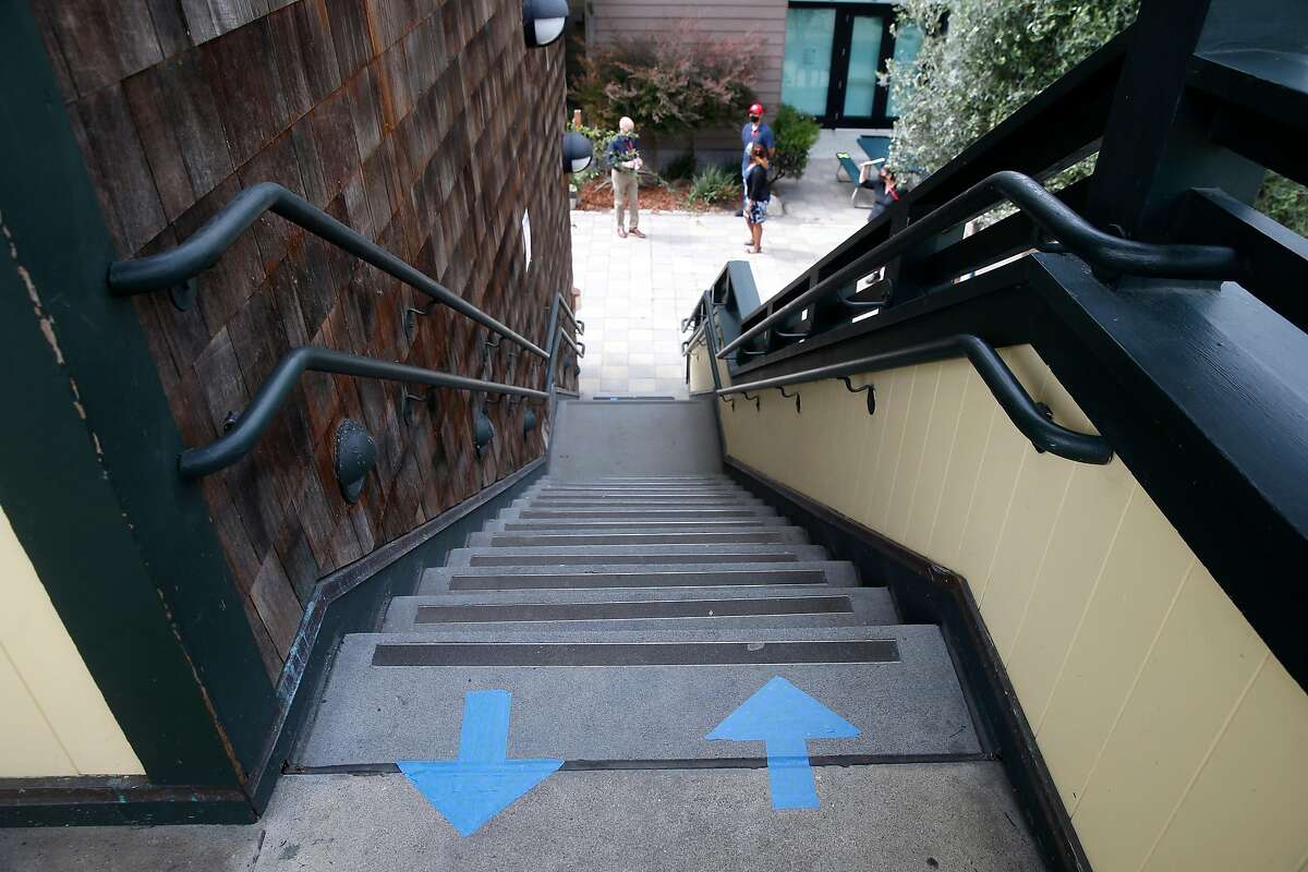 Stairs are marked with directional arrows. City officials conduct an inspection of The San Francisco School before authorizing in-person learning on the campus in San Francisco, Calif. on Thursday, Sept. 17, 2020. The private school with 285 students enrolled is among the first school's in the city to apply for in-classroom instruction.