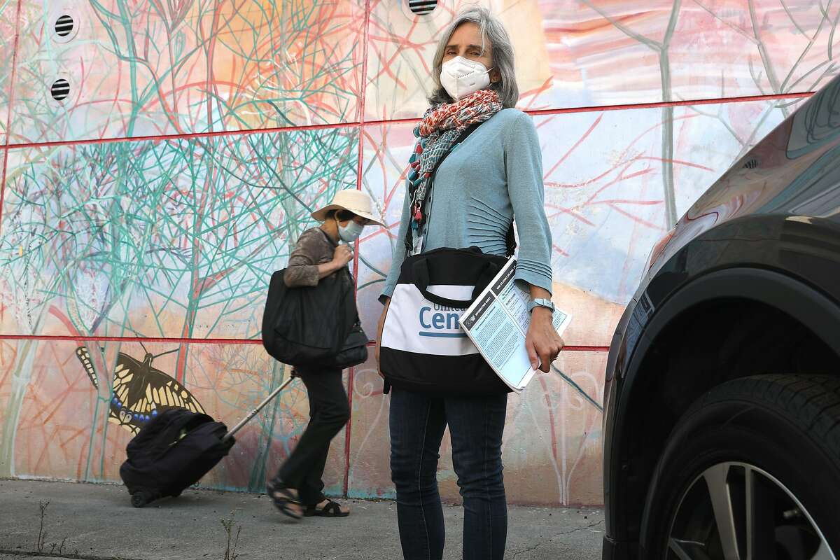 Census enumerator Amy Tanner walks on San Jose Ave. in her neighborhood on Thursday, Sept. 17, 2020, in San Francisco, Calif.