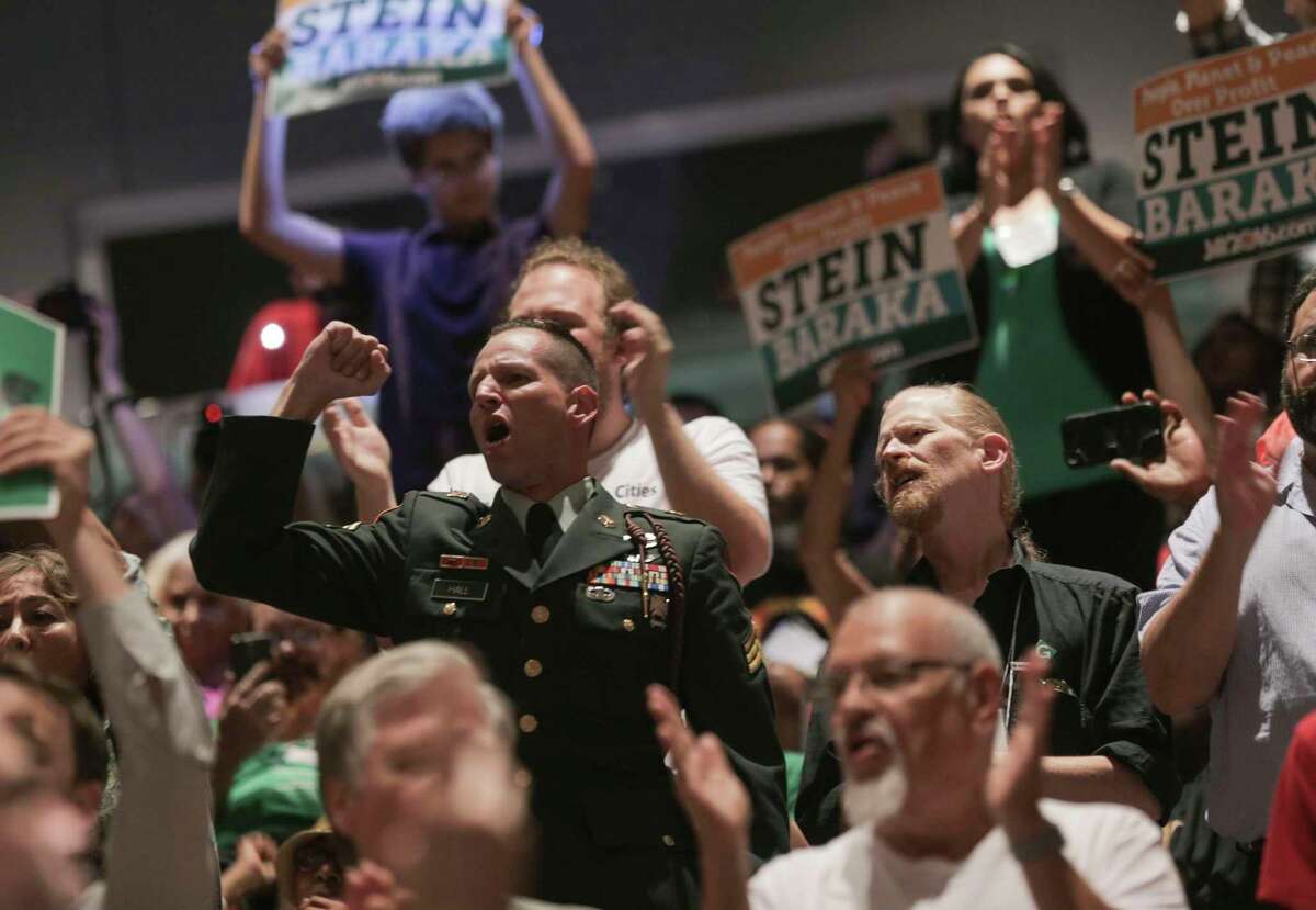 Attendees of the Green Party’s National Convention yell “No more war” during the convention on Saturday, Aug. 6, 2016, in Houston. ( Elizabeth Conley / Houston Chronicle )