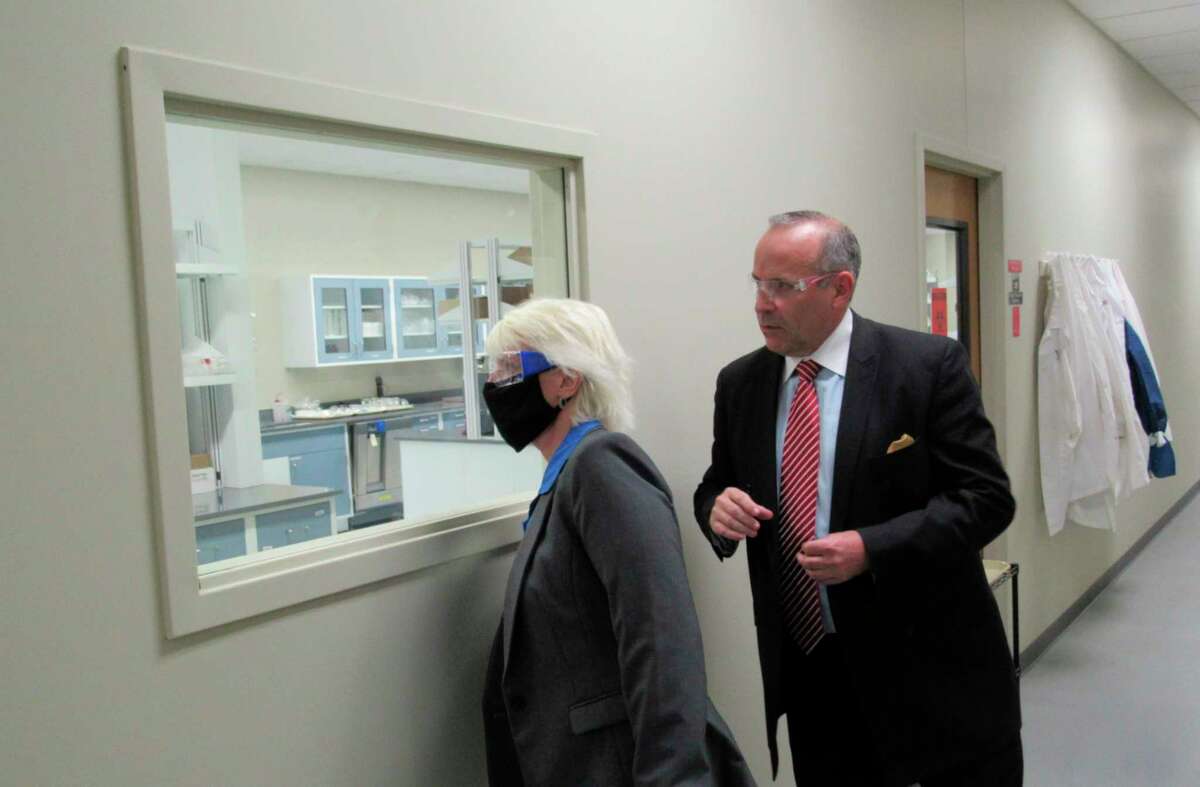 Impact Analytical CEO Neil Chapman, right, leads state representative Annette Glenn on a tour of Impact's laboratory facilities on Sept. 18, 2020. (Mitchell Kukulka/Mitchell.Kukulka@mdn.net).