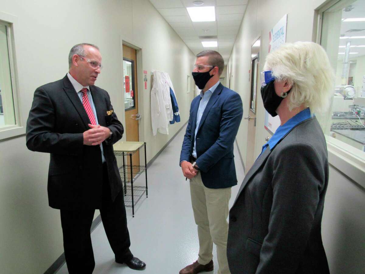 Impact Analytical CEO Neil Chapman, left, leads Lee Chatfield, speaker of the Michigan House of Representatives, and state representative Annette Glenn on a tour of Impact's laboratory facilities on Sept. 18, 2020. (Mitchell Kukulka/Mitchell.Kukulka@mdn.net).