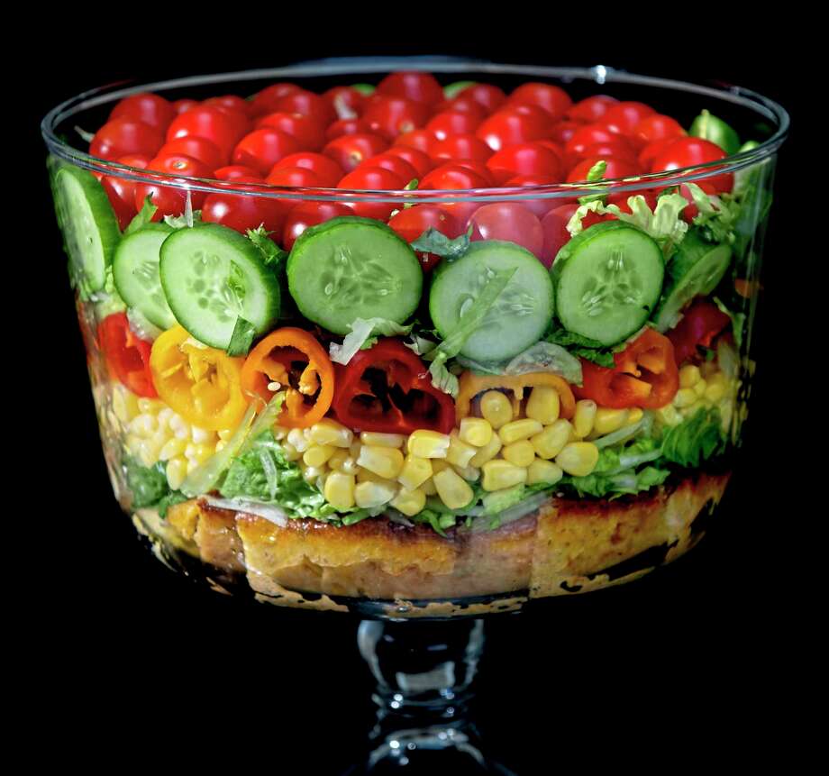 Built on a layer of savory cornbread, the summer trifle salad is made with shredded romaine lettuce, sweet corn, mini peppers, cucumbers and cherry tomatoes. Shot in Oakmont, Pennsylvania on Friday, Aug. 21, 2020. (Steve Mellon/TNS) / Pittsburgh Post-Gazette