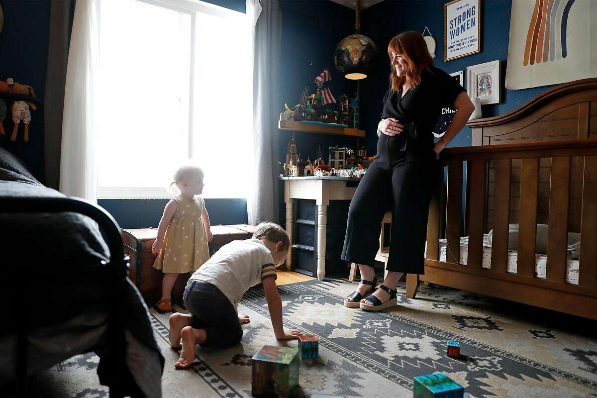 Sam Brancato with her son, Max, 5, and daughter, Luna, 18 months, at their home in San Francisco, Calif., on Thursday, September 17, 2020. Brancato, who is pregnant, is concerned about the effect of wildfire smoke on her unborn child.