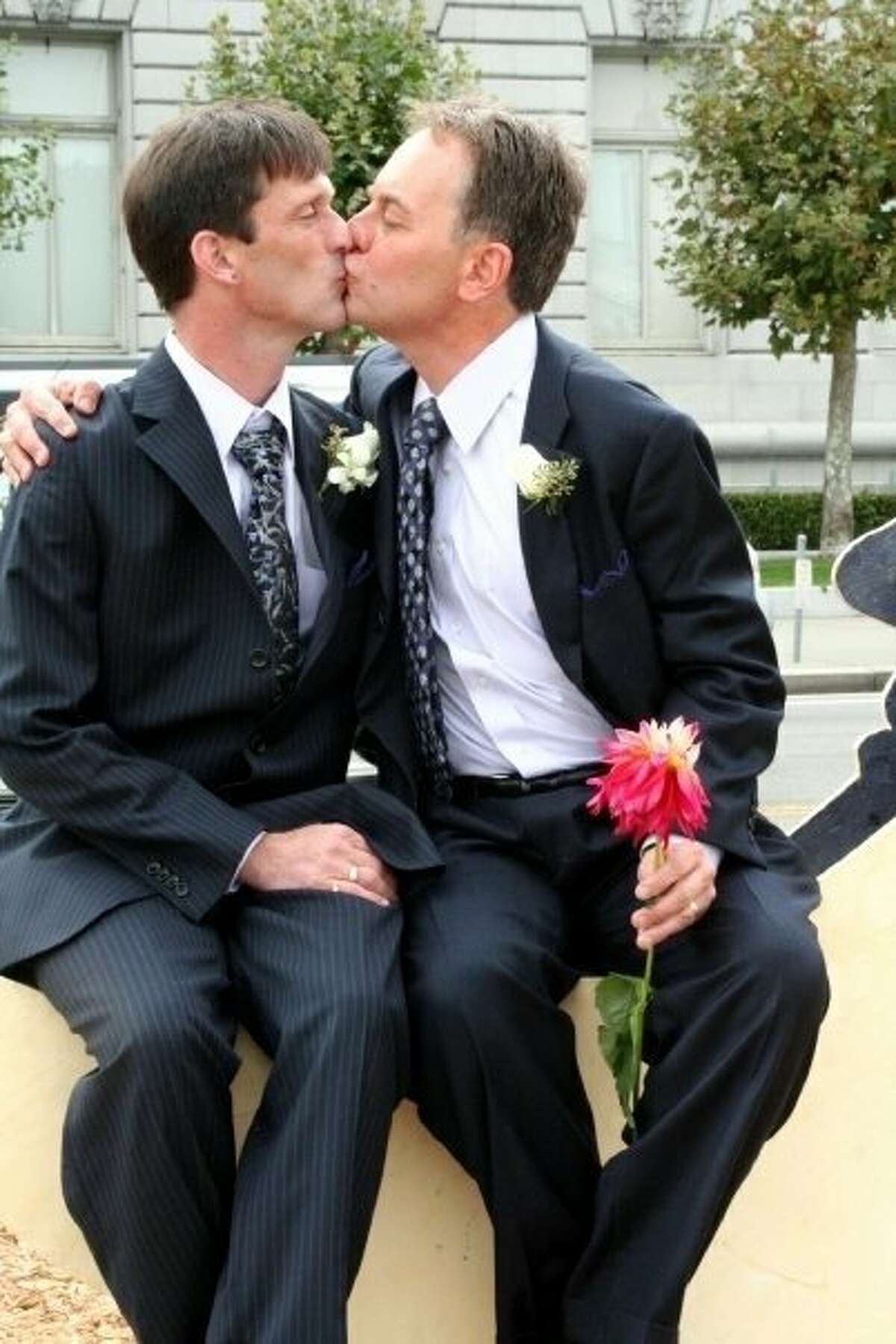 Brian and Kevin Fisher-Paulson pose for a photo on their wedding day on Sept. 19, 2008. In 2020, the couple celebrates 35 years since they first met.