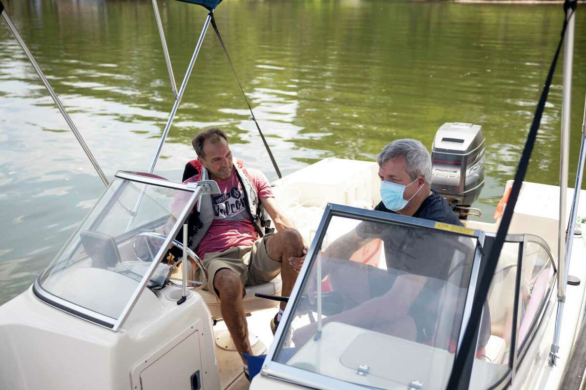 Rob, left and Nick McCord prepares to take off into the water at the Palms Marina in Conroe.