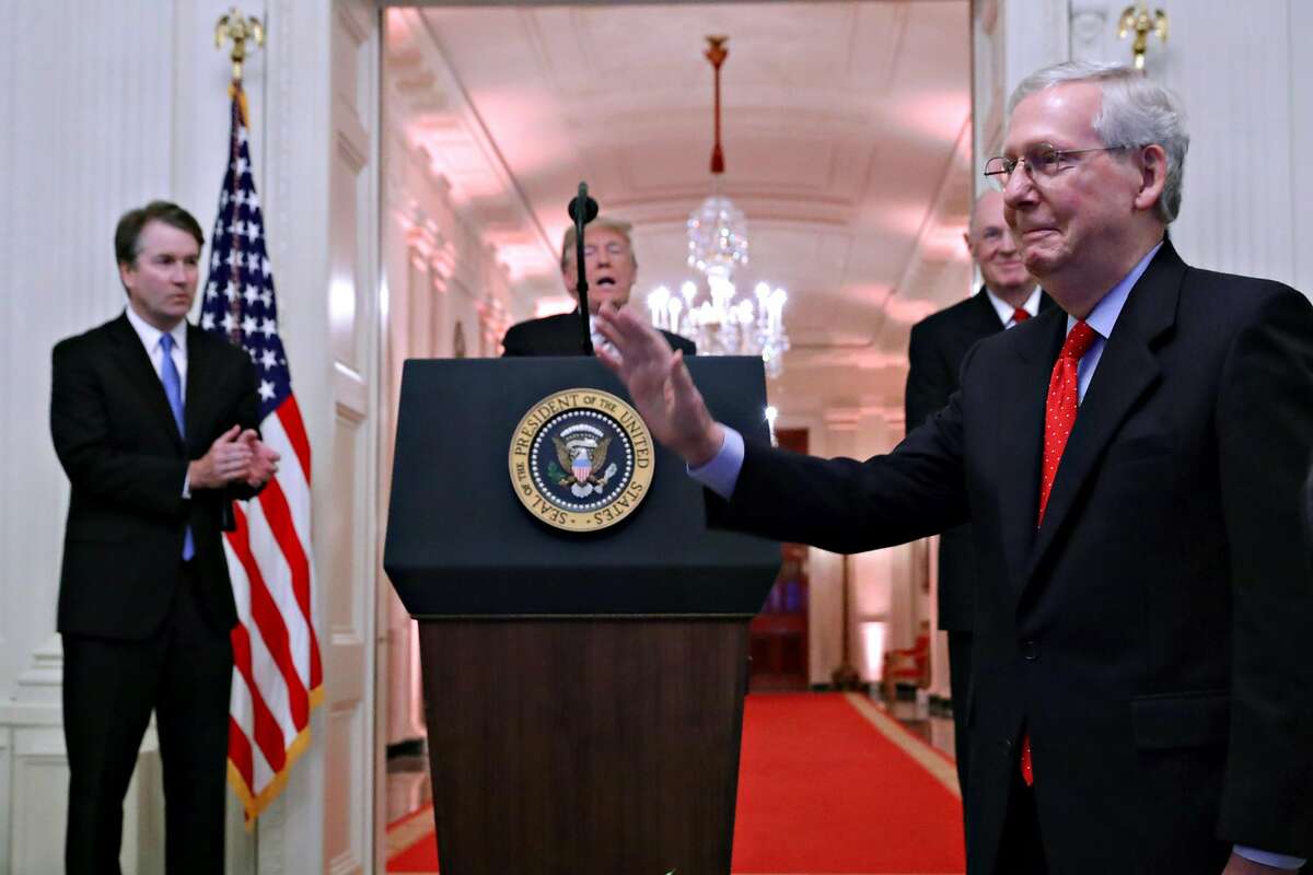 WASHINGTON, DC - OCTOBER 08: Senate Majority Leader Mitch McConnell (R-KY) (R) receives a standing ovation during the ceremonial swearing in of Supreme Court Associate Justice Brett Kavanaugh (L) with U.S. President Donald Trump (C) and retired Justice An