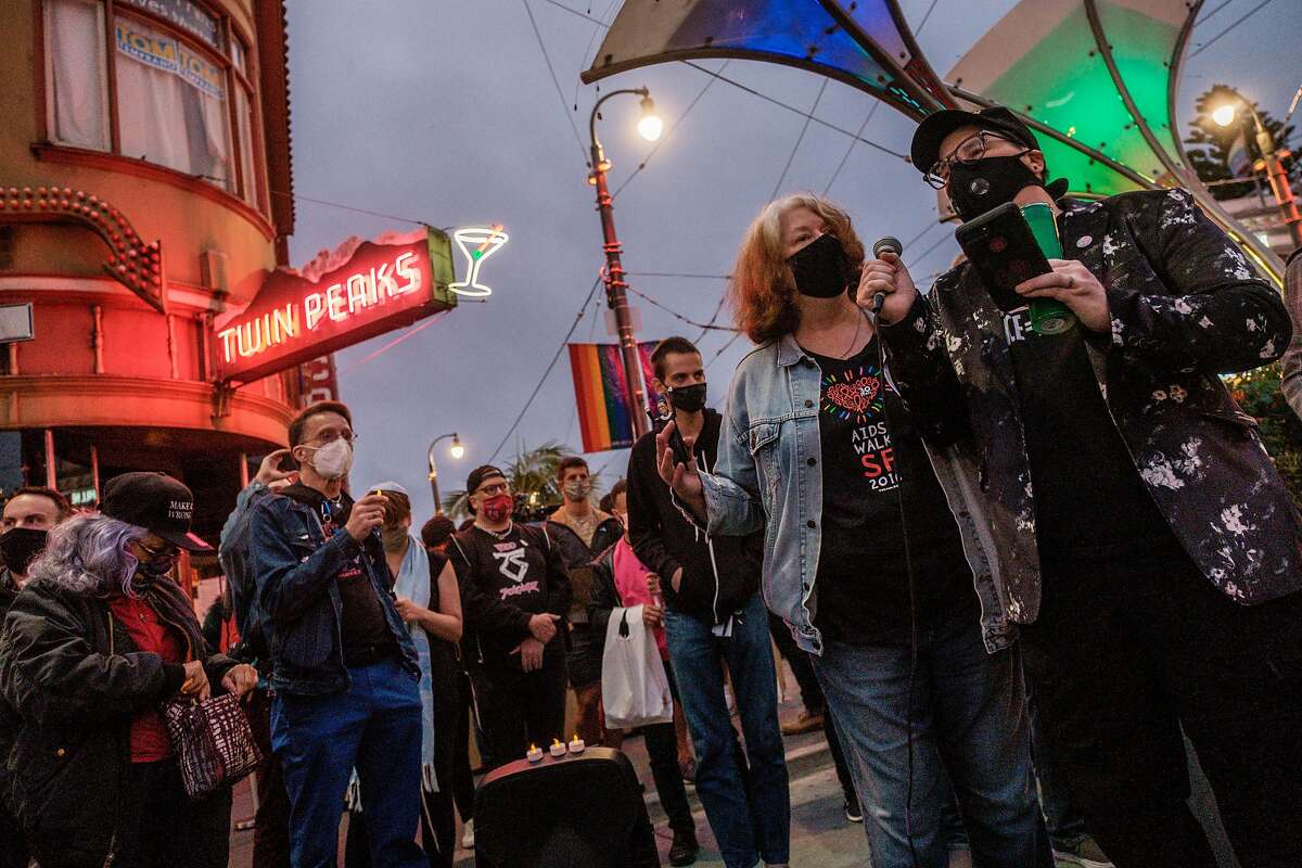 People attend a vigil for Supreme Court Justice Ruth Bader Ginsburg in the Castro, just hours after her death was announced in San Francisco on Friday, September 18, 2020. Bader Ginsburg, has died at the age of 87 after a battle with pancreatic cancer.