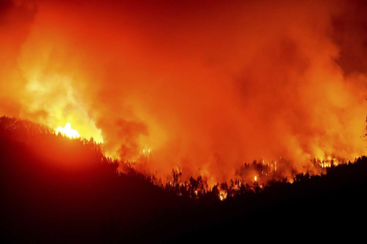 The August Complex Fire burns near Lake Pillsbury in the Mendocino National Forest, Calif., on Wednesday, Sept. 16, 2020. (AP Photo/Noah Berger)