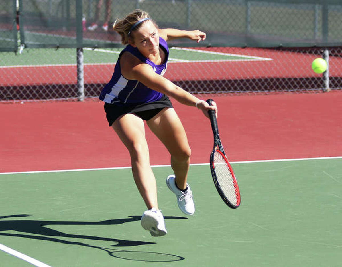 CM junior Allie Lively extends to return a shot during a singles match against Collinsville during Alton’s Robert Logan Invitational girls tennis tournament Saturday morning in Troy. The eight-team tourney was played at courts at Alton and Triad high schools, Gordon Moore Park and Tri-Township Park in Troy.
