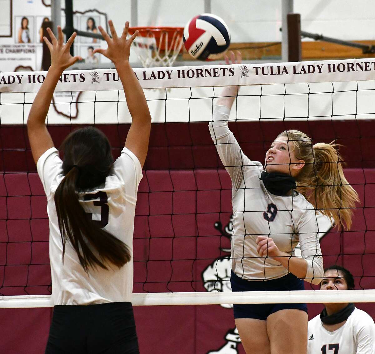 Plainview's Haley Curtis powers a kill past Tulia defender Allie Ramirez during their non-district high school volleyball match on Saturday, Sept. 19, 2020 in Tulia.