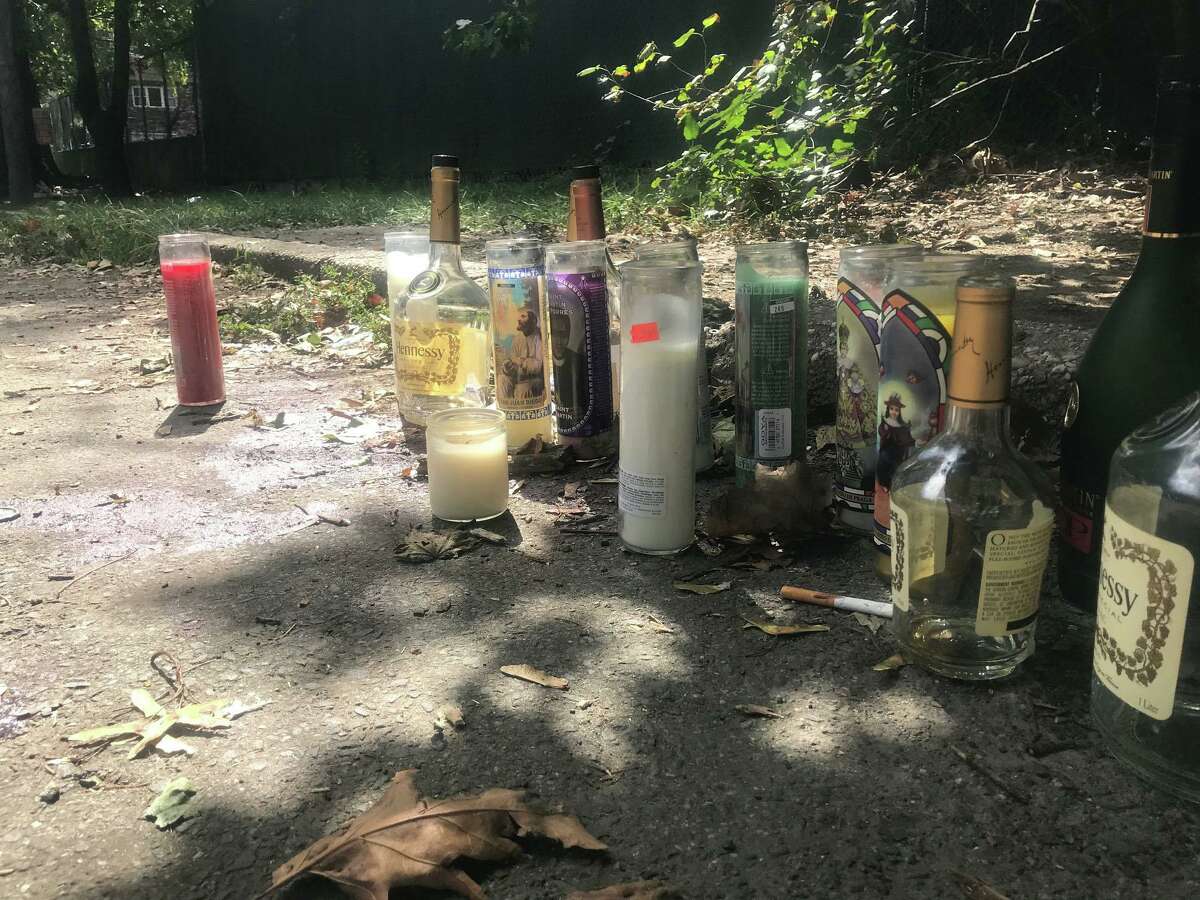 Candles are Sunday left at the scene of a shooting in which a Stamford woman was killed on Stamford’s East Side early Sunday morning.