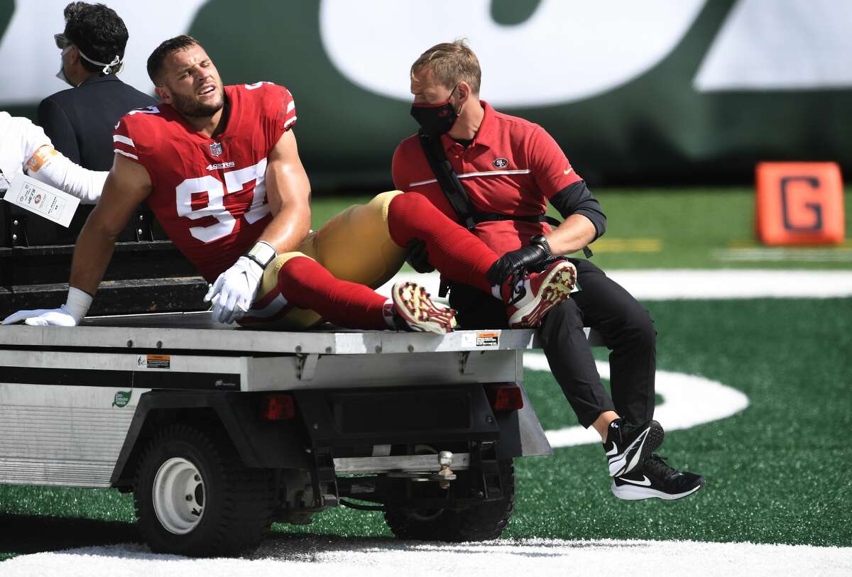 Nick Bosa #97 of the San Francisco 49ers is carted off the field after sustaining an injury during the first half against the New York Jets at MetLife Stadium on September 20, 2020 in East Rutherford, New Jersey. (Photo by Sarah Stier/Getty Images)