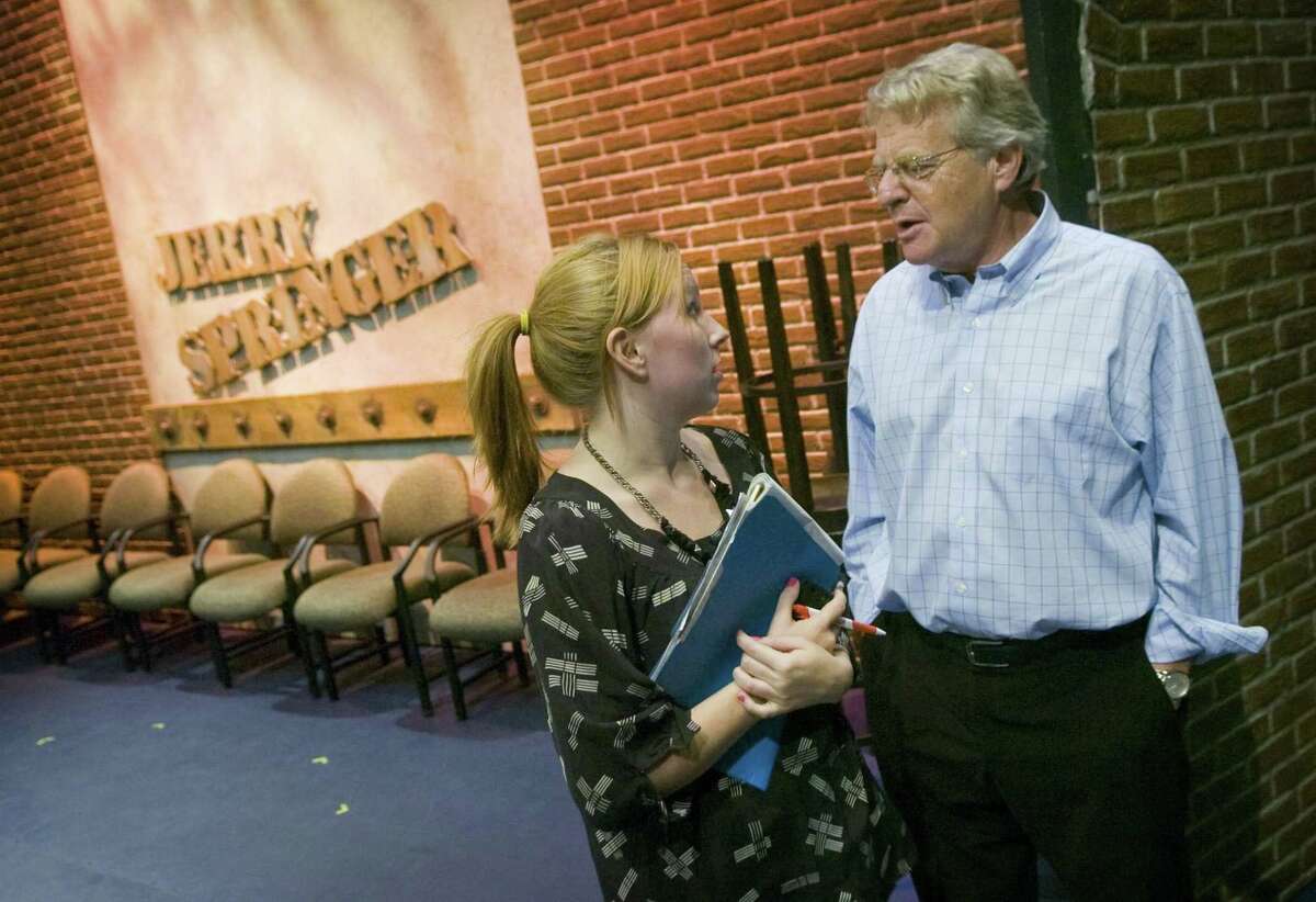 Stamford_081009_ Jerry Springer talks to an NBC worker during the first day of taping for his show in Stamford, Conn., on Monday, August 10, 2009.