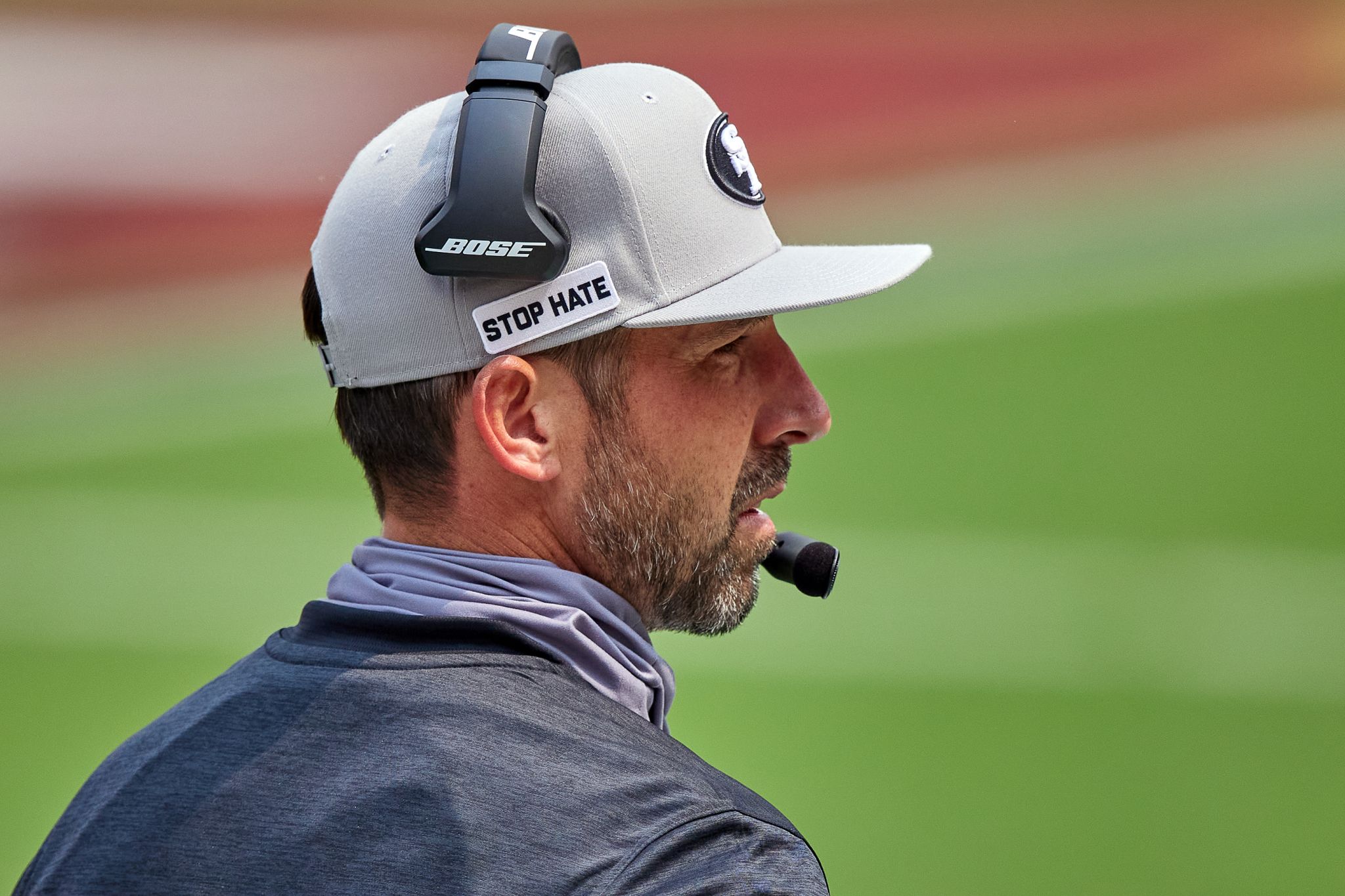 Kyle Shanahan jokes he's 'company guy' for wearing new hats this