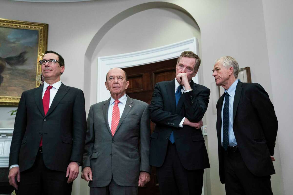 Treasury Secretary Steve Mnuchin, left, Commerce Secretary Wilbur Ross, U.S. Trade Representative Robert Lighthizer and White House National Trade Council Director Peter Navarro attend a White House signing event in March 2018.