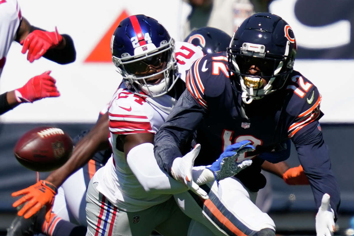 New York Giants cornerback James Bradberry (24) defends Chicago Bears wide receiver Allen Robinson (12) during the first half of an NFL football game in Chicago, Sunday, Sept. 20, 2020. (AP Photo/Charles Rex Arbogast)