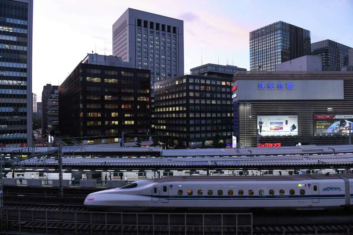 A Shinkansen bullet train travels along an elevated railway track passing Yurakucho station in Tokyo, Japan, on Sept. 8, 2020. Similar trains will operate along a planned Houston-to-Dallas line which has gained federal approval.
