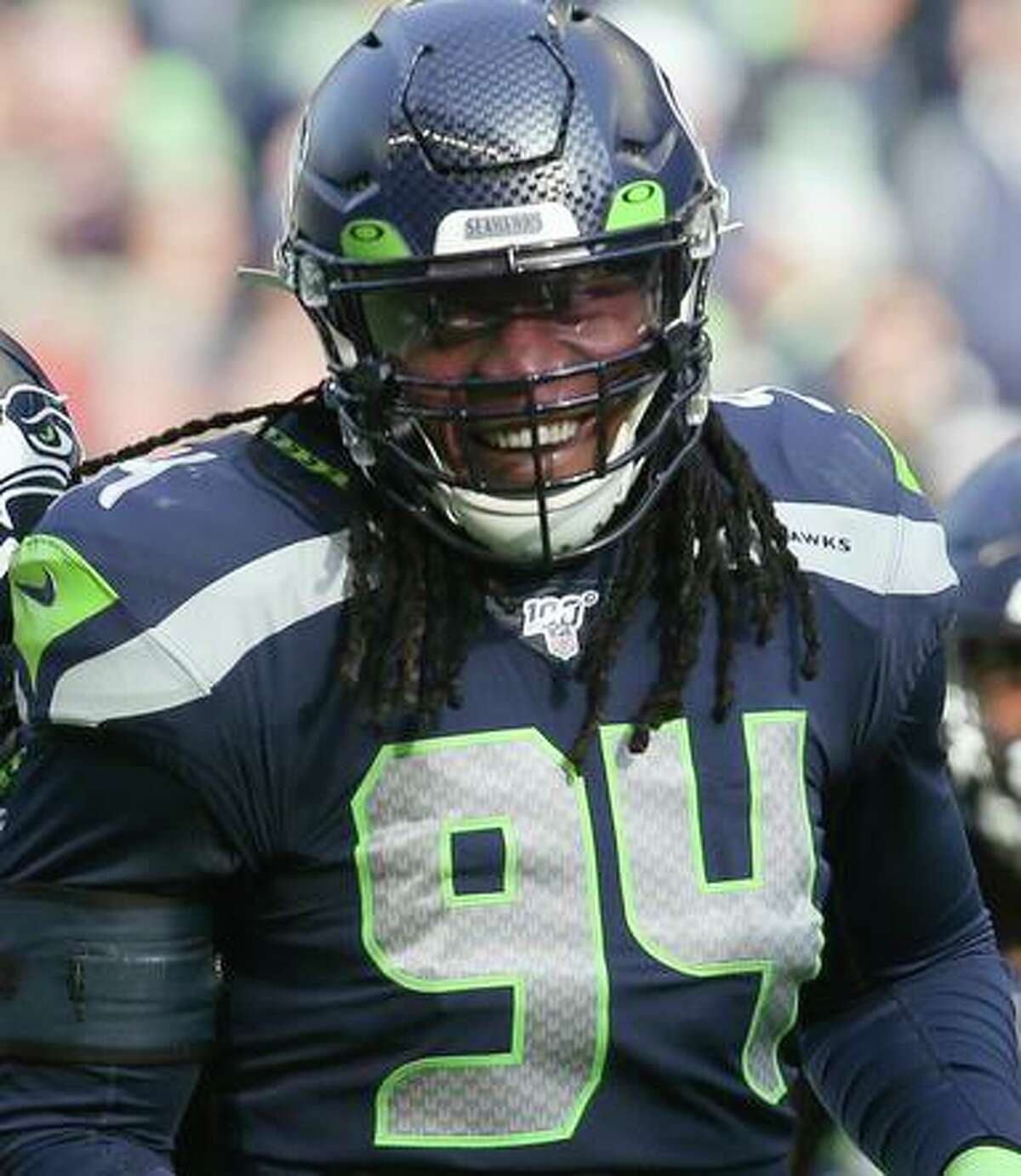Former Seattle defensive end Ziggy Ansah, center, is expected to sign with the 49ers this week.