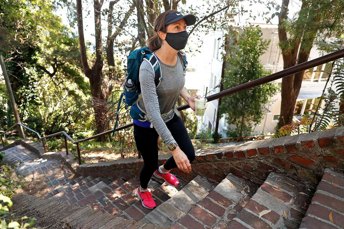 Alexandra Kenin climbs the Greenwich Street steps in Telegraph Hill neighborhood of San Francisco, Calif., on Wednesday, August 12, 2020. Kenin has climbed all 900 outdoor staircases in San Francisco and logged them online.