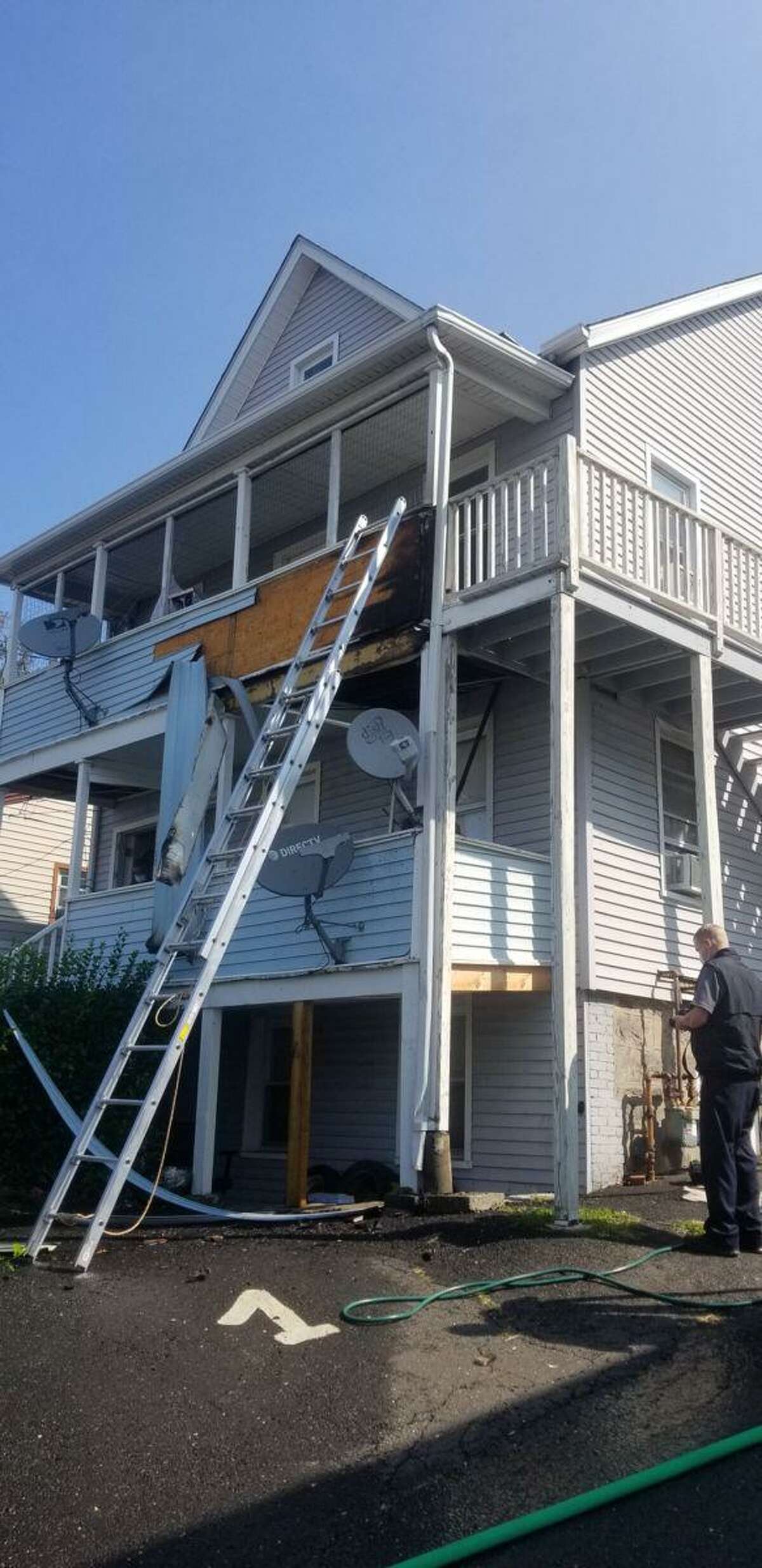 Quick acting neighbors who reported a fire at a multifamily home on Lockwood Avenue on Monday helped firefighters extinguish the blaze before it reached the interior of the home.