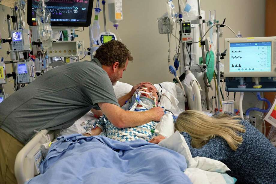 Arnold and Angie Andrews grieve over their son, Will, after making the decision to remove him from life support at Zuckerberg San Francisco General Hospital and Trauma Center on December 6, 2019. Will Andrews died the following day. Photo: Guy Wathen / The Chronicle / **MANDATORY CREDIT FOR PHOTOG AND SF CHRONICLE/NO SALES/MAGS OUT/TV