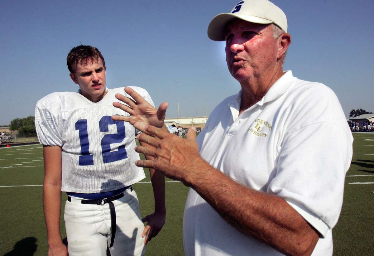 File photo of then varsity football coach Sonny Detmer and his grandson Steven Dorman during football workouts at Somerset High School in 2008.