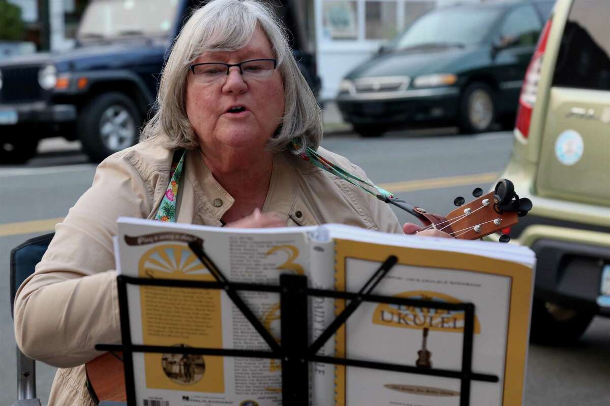 Kris Nilsen of Westport plays at the monthly ukulele meet-up outisde the Horseshoe Cafe on Tuesday, Sept.15, 2020, in Fairfield, Conn.