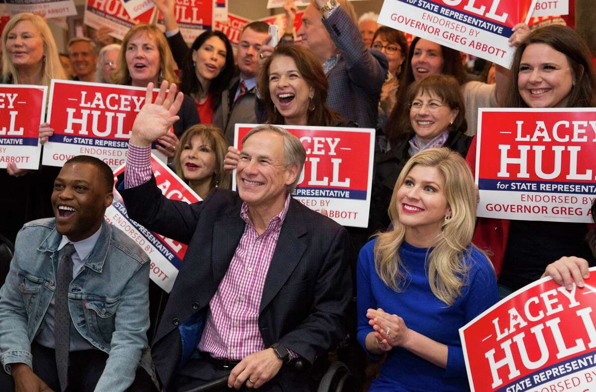Texas Gov. Greg Abbott records a video with Lacey Hull, right, candidate for State Representative in House District 138, and her supporters during a campaign event Monday, Feb. 24, 2020, at Fratelli's Ristorante in Houston. The governor endorsed Hull on February 11, 2020.