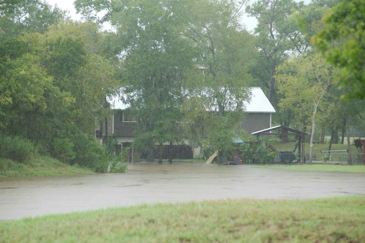 Clear Creek spills out of its banks and into homes near Sleepy Hollow and Scarsdale Boulevard in Pearland.